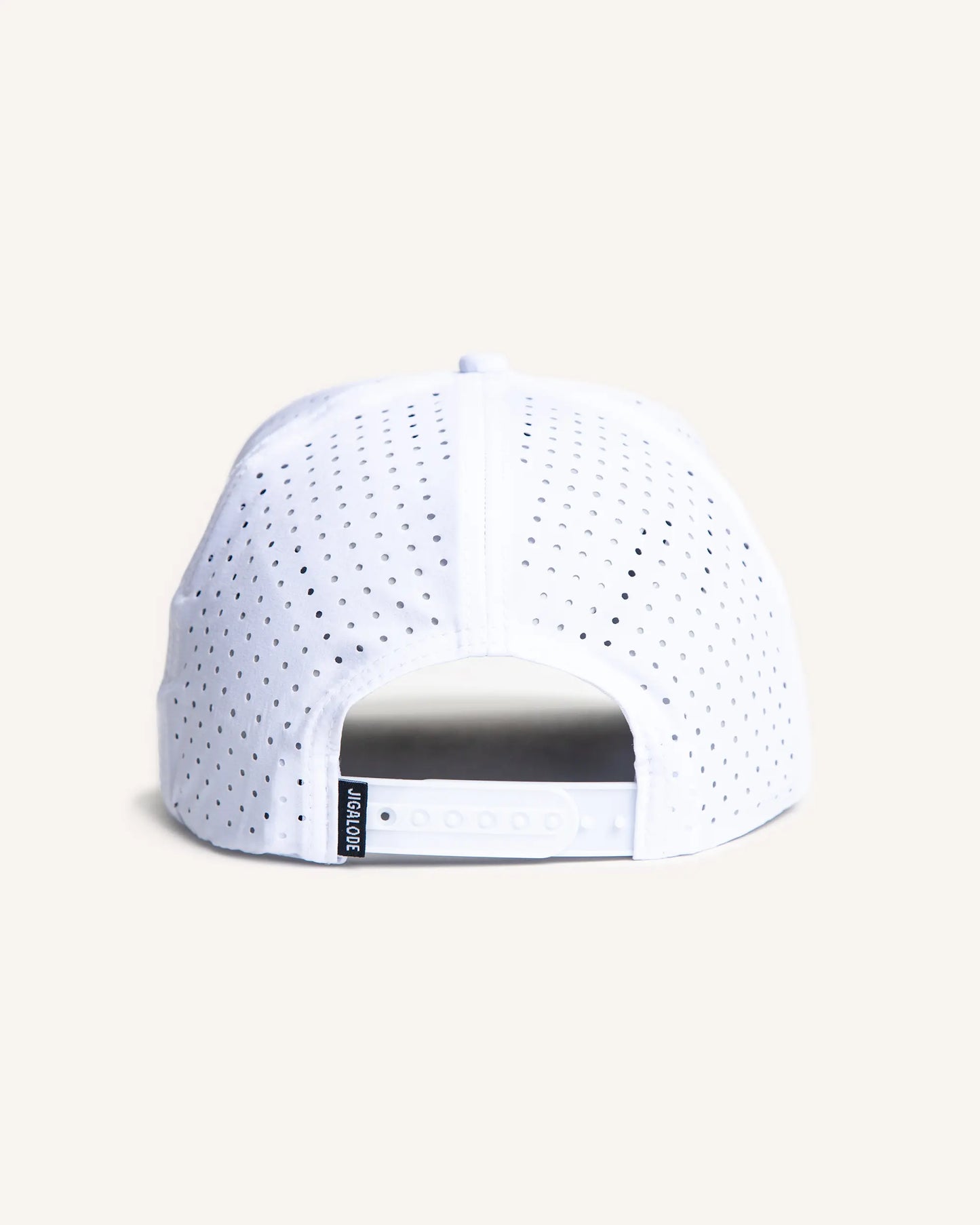Back of White perforated performance snapback with a black and white rubber Jigalode patch in front.