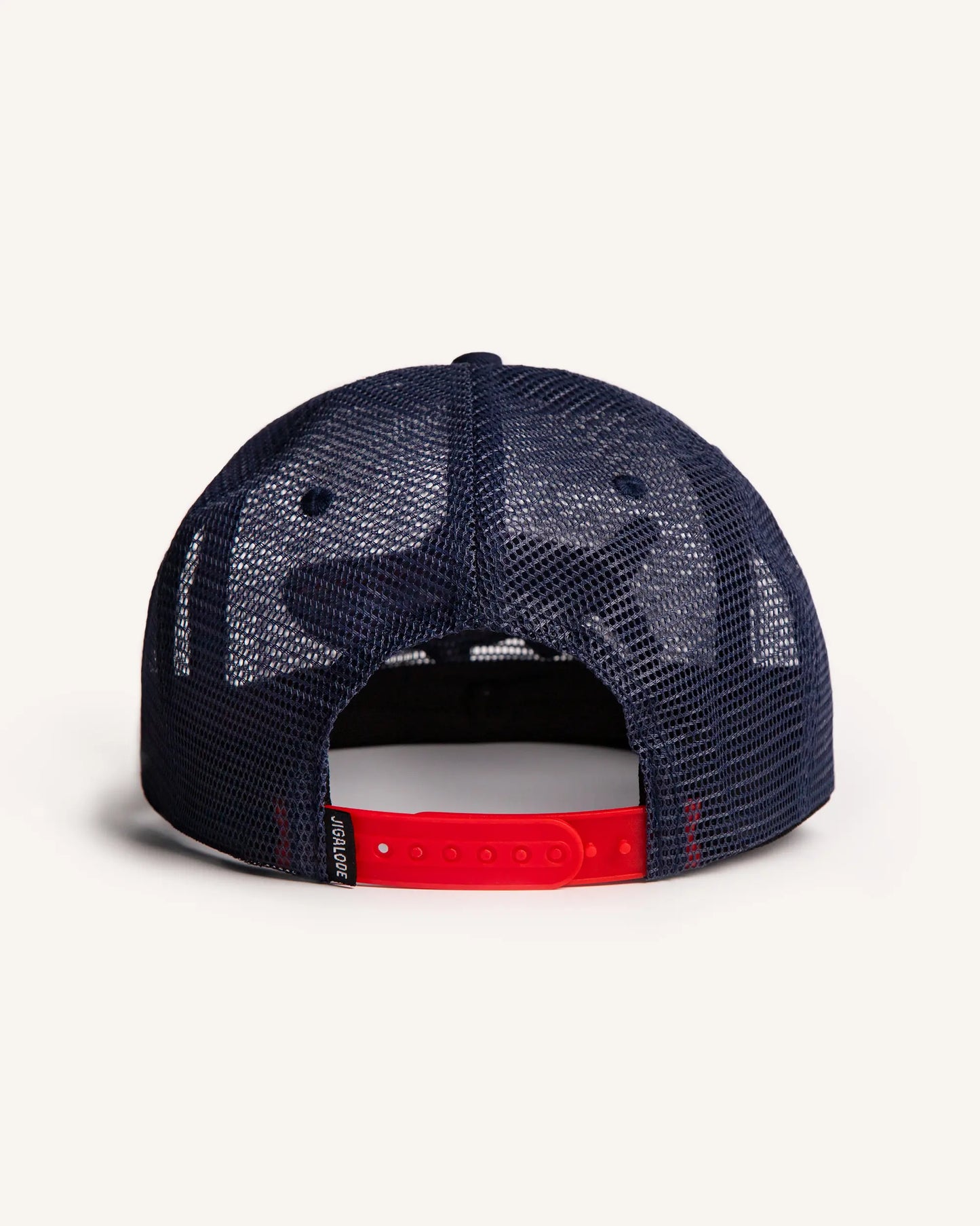 Back shot of the Red White & Poon Snapback. It is a navy blue, full mesh snapback with a red, white and blue striped tarpon patch.