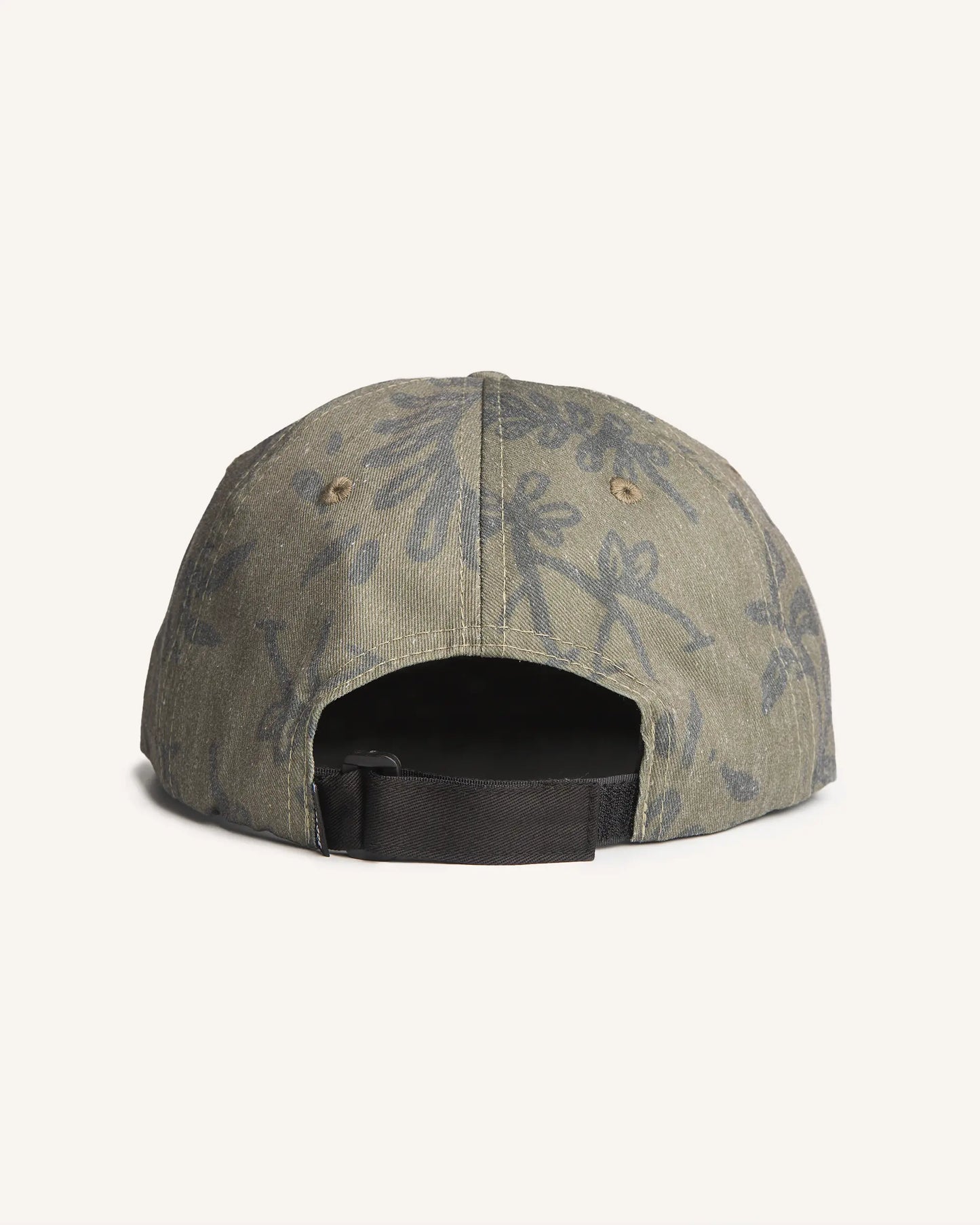 Back view of the Jigalode "Mighty Jig" 5-Panel hat. The hat is a moss green color with a tropical plant pattern printed all over. The front of the fishing hat features the Jigalode "Mighty Jig" logo.