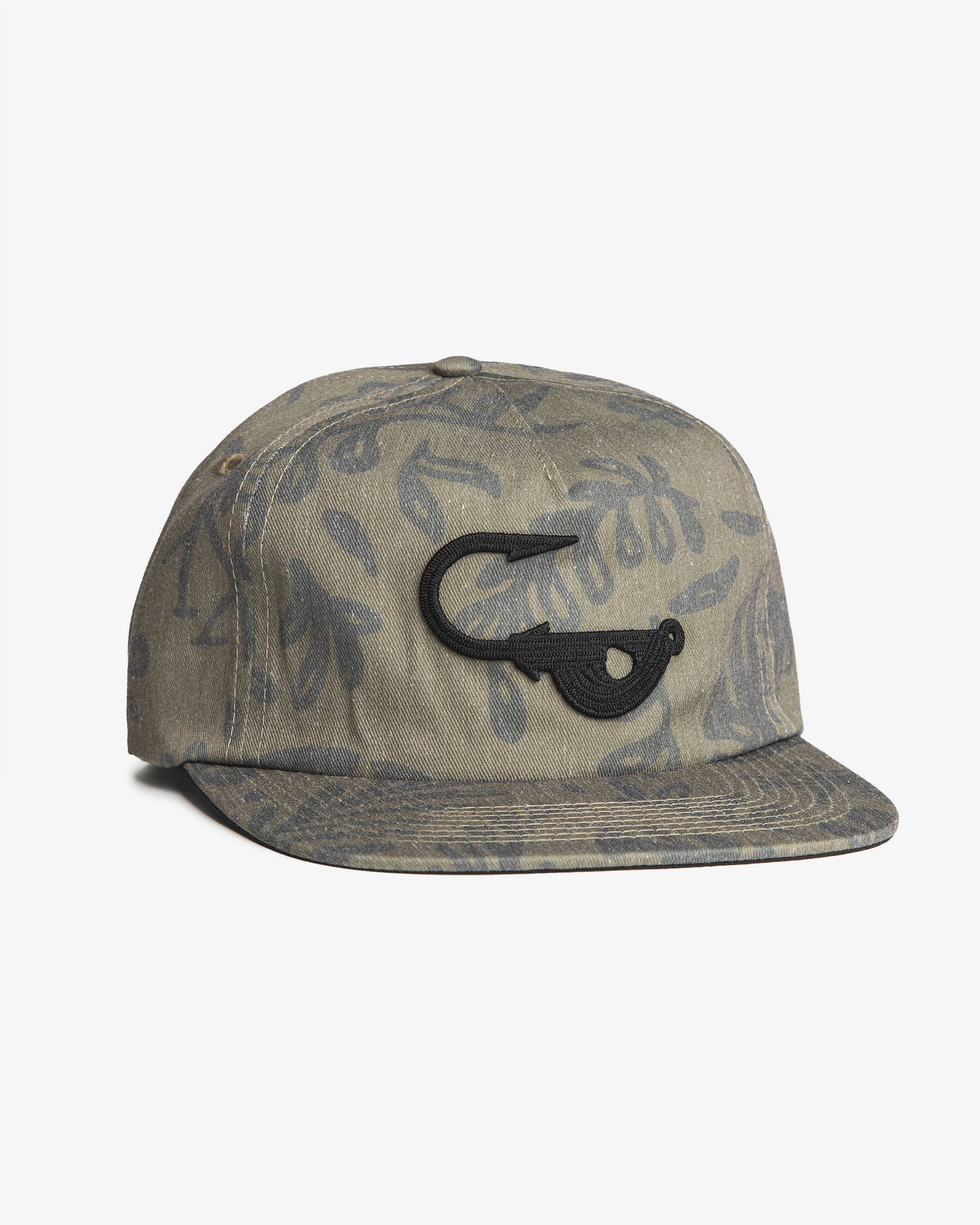Angled front view of the Jigalode "Mighty Jig" 5-Panel hat. The hat is a moss green color with a tropical plant pattern printed all over. The front of the fishing hat features the Jigalode "Mighty Jig" logo.