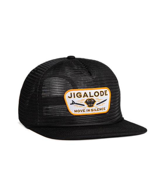 Angled view of the 'Move In Silence' Mesh Snapback fishing hat in all black. The hat features a full mesh design with paracord rope detail across the brim. The plastic snap closure ensures a secure fit. The golden yellow patch on the front showcases an alligator snapping a push pole in half, adding a bold and unique touch to the hat.