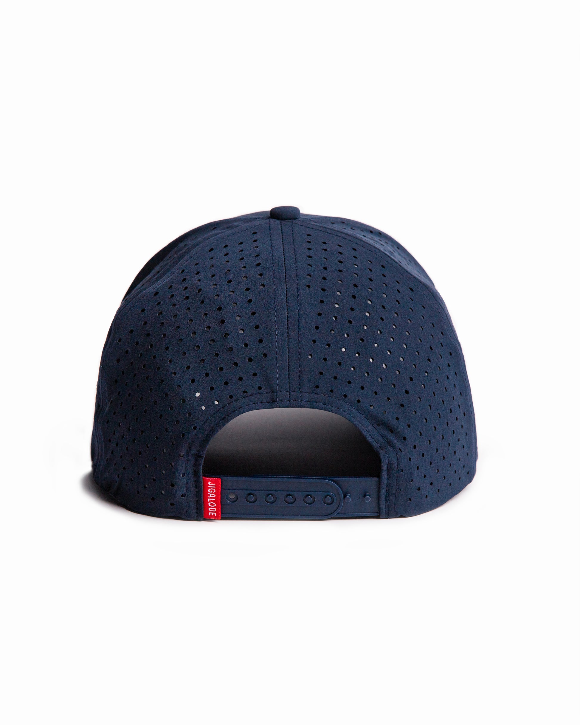 Back shot of the Permit Performance Snapback. Navy blue hat with laser perforated holes and a red and white woven patch of a permit fish.