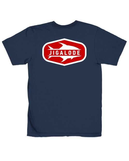 The back of the Permit Tee from Jigalode features a red and white permit fish badge on a navy blue t-shirt.