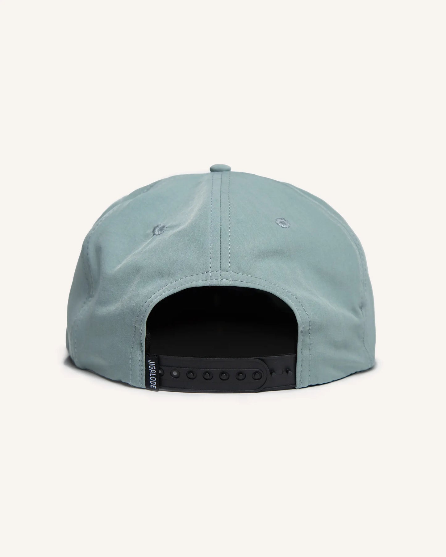 Back of Light blue fishing snapback hat with a bonefish patch on the front.