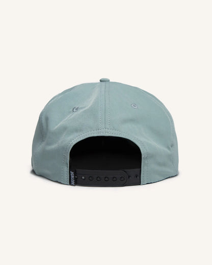 Back of Light blue fishing snapback hat with a bonefish patch on the front.