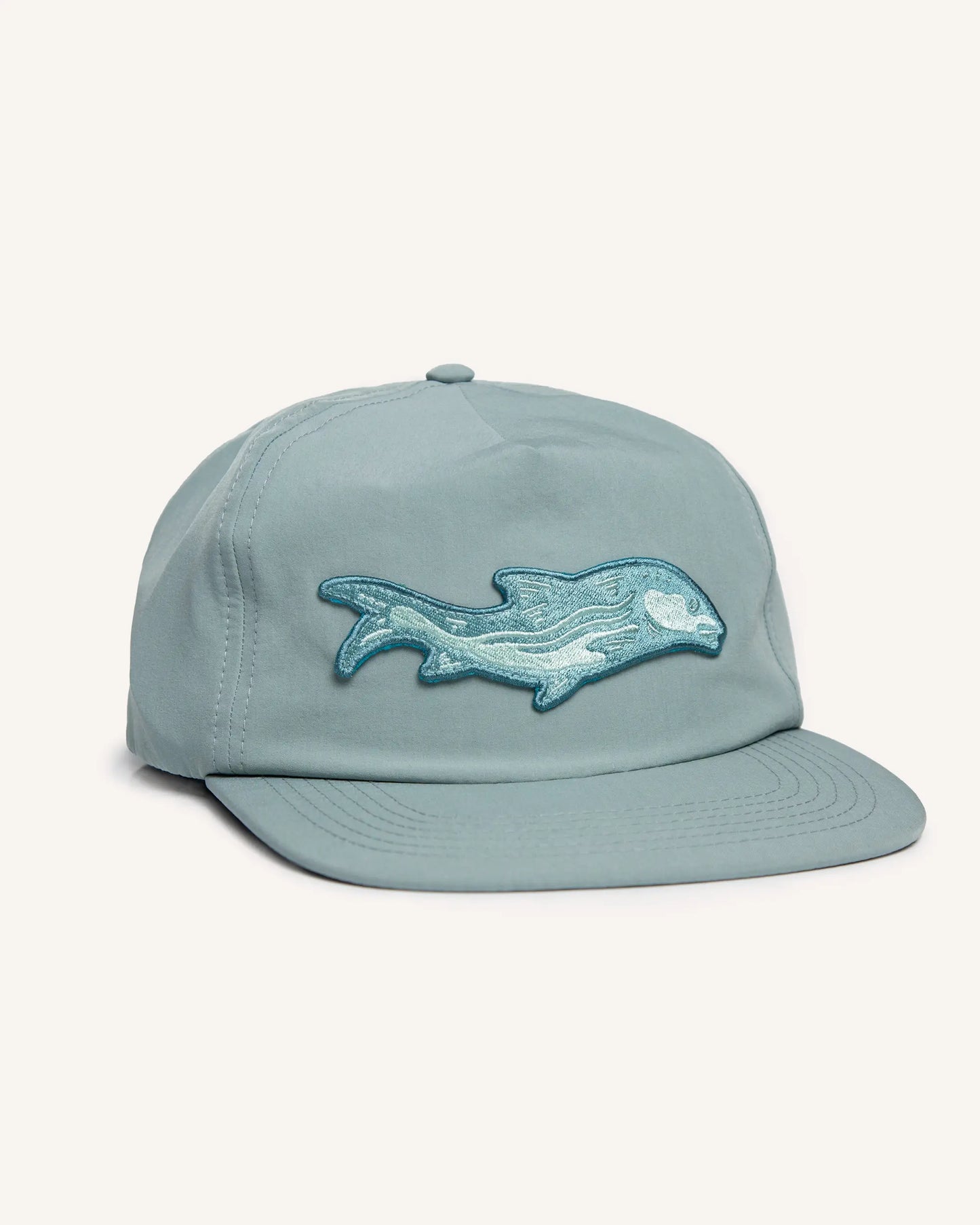 Light blue fishing snapback hat with a bonefish patch on the front.