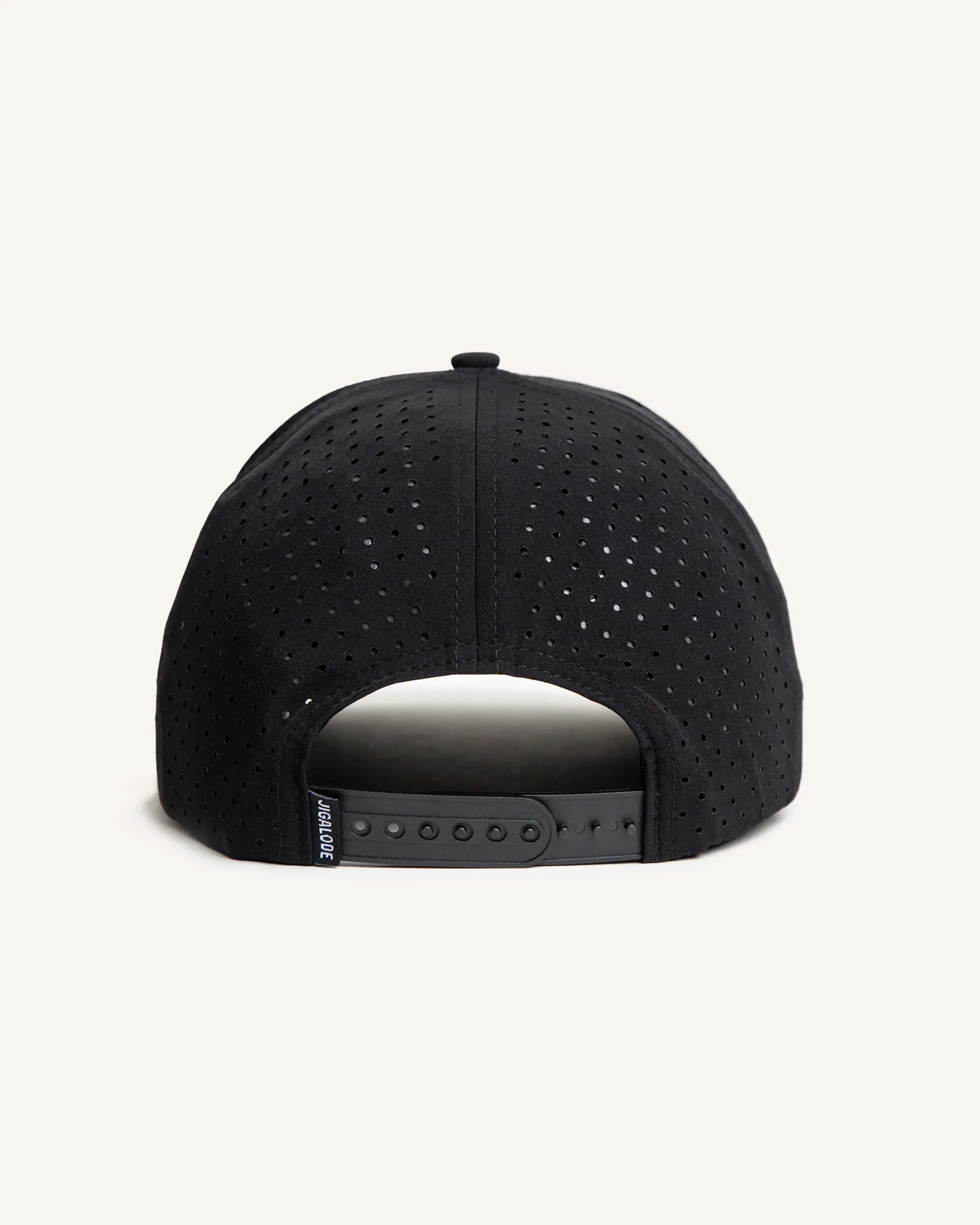 Back of Black performance fishing snapback with perforated holes and a rubber jigalode patch sewn in the front.