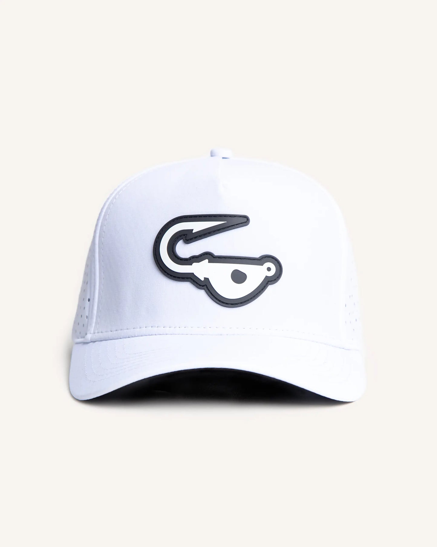 White perforated performance snapback with a black and white rubber Jigalode patch in front. 