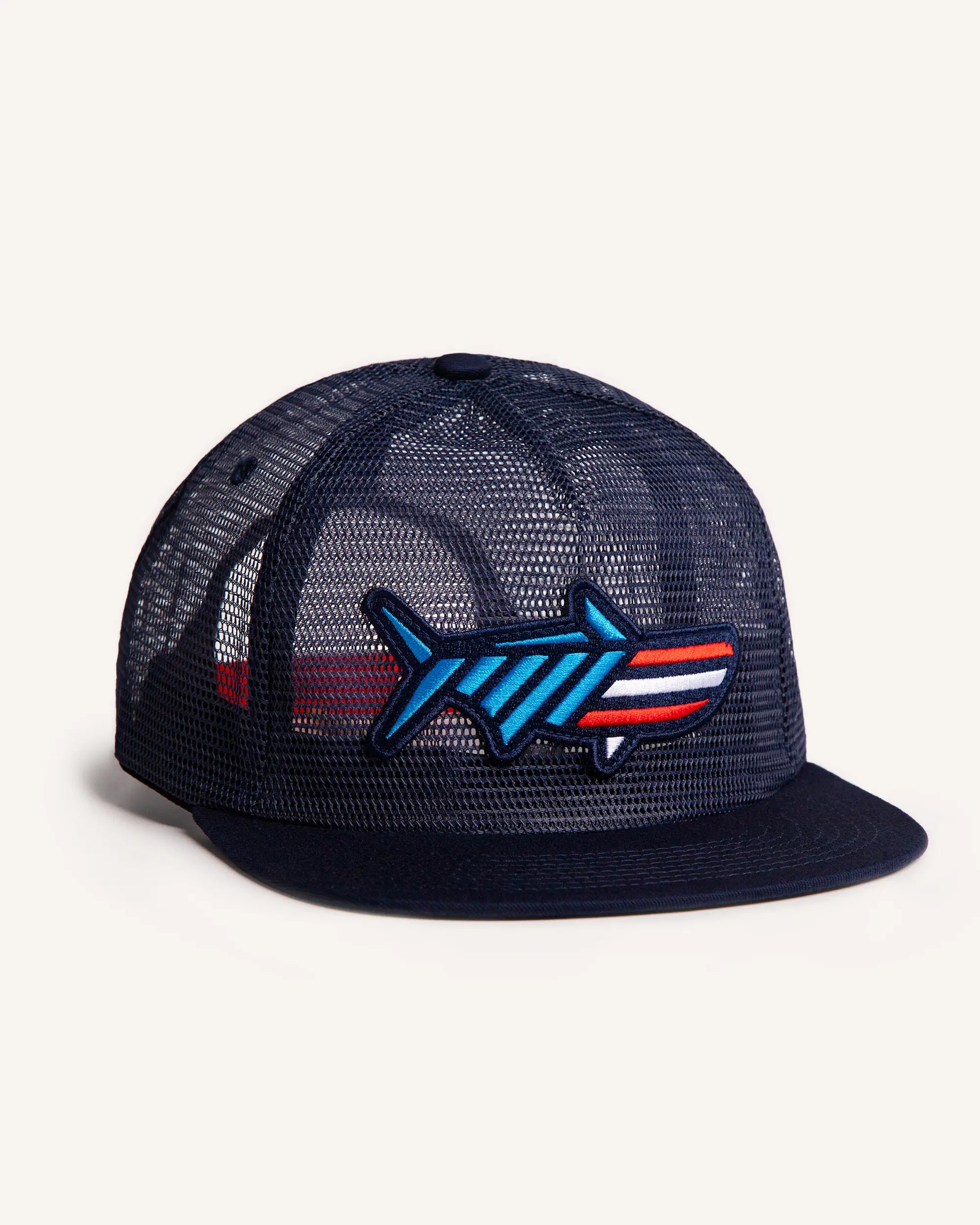 Angled shot of the Red White & Poon Snapback. It is a navy blue, full mesh snapback with a red, white and blue striped tarpon patch. 