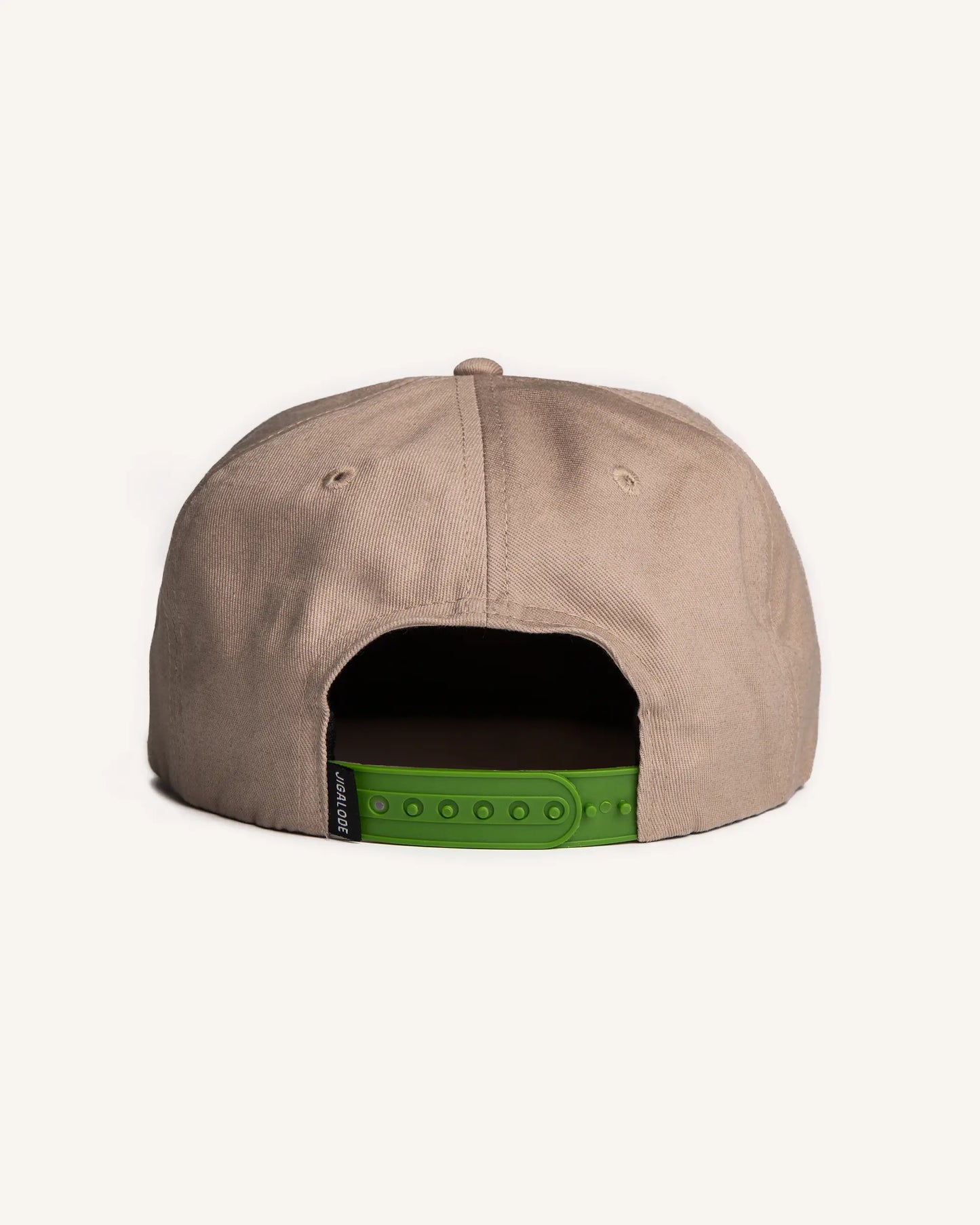 Back front view of the Jigalode "Tarpon" Snapback fishing hat. The hat is a tan/khaki unstructured flat brim with a large tarpon patch in the front.