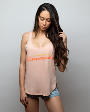Young woman wearing a peach tank top that reads "I Left My Heart in Islamorada" from fishing brand, Jigalode
